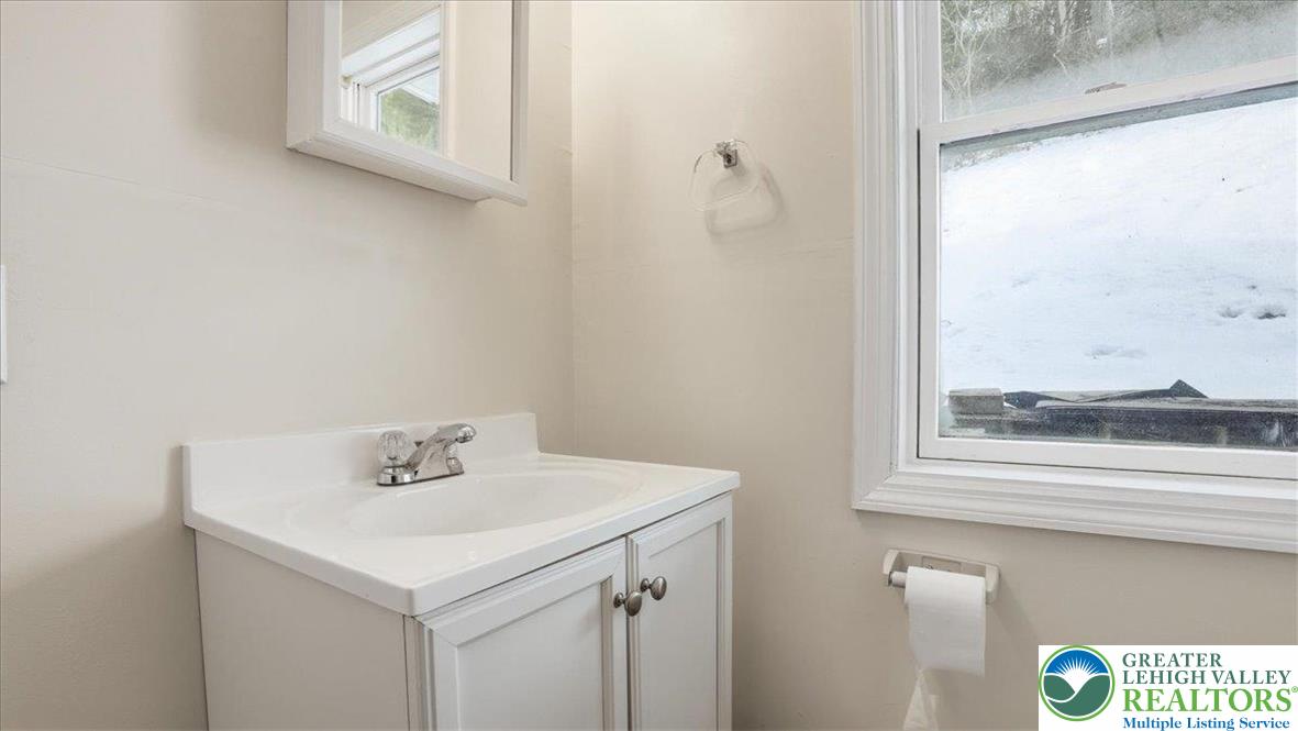 1032 Clamtown Road New Ringgold, PA 17960 - Photo 26 of 68 a bathroom with a sink and a mirror