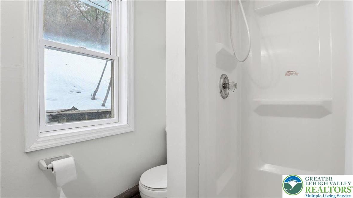 1032 Clamtown Road New Ringgold, PA 17960 - Photo 39 of 68 a white toilet sitting next to a bathroom sink