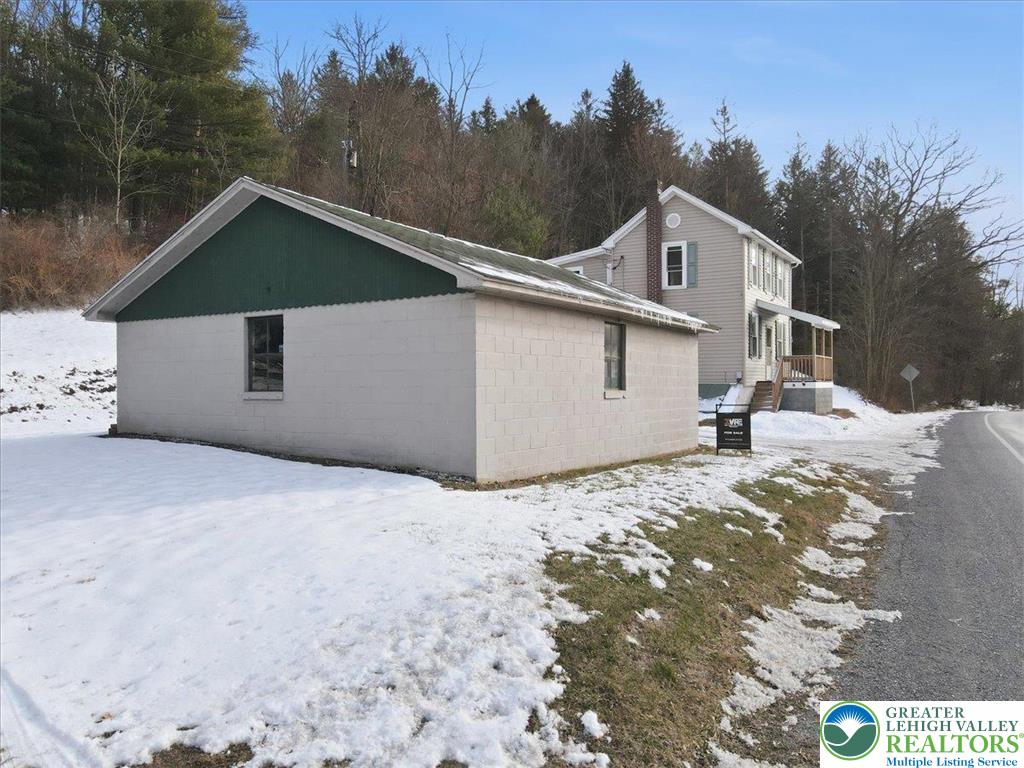 1032 Clamtown Road New Ringgold, PA 17960 - Photo 45 of 68 a view of a house with a snow yard and mountain view