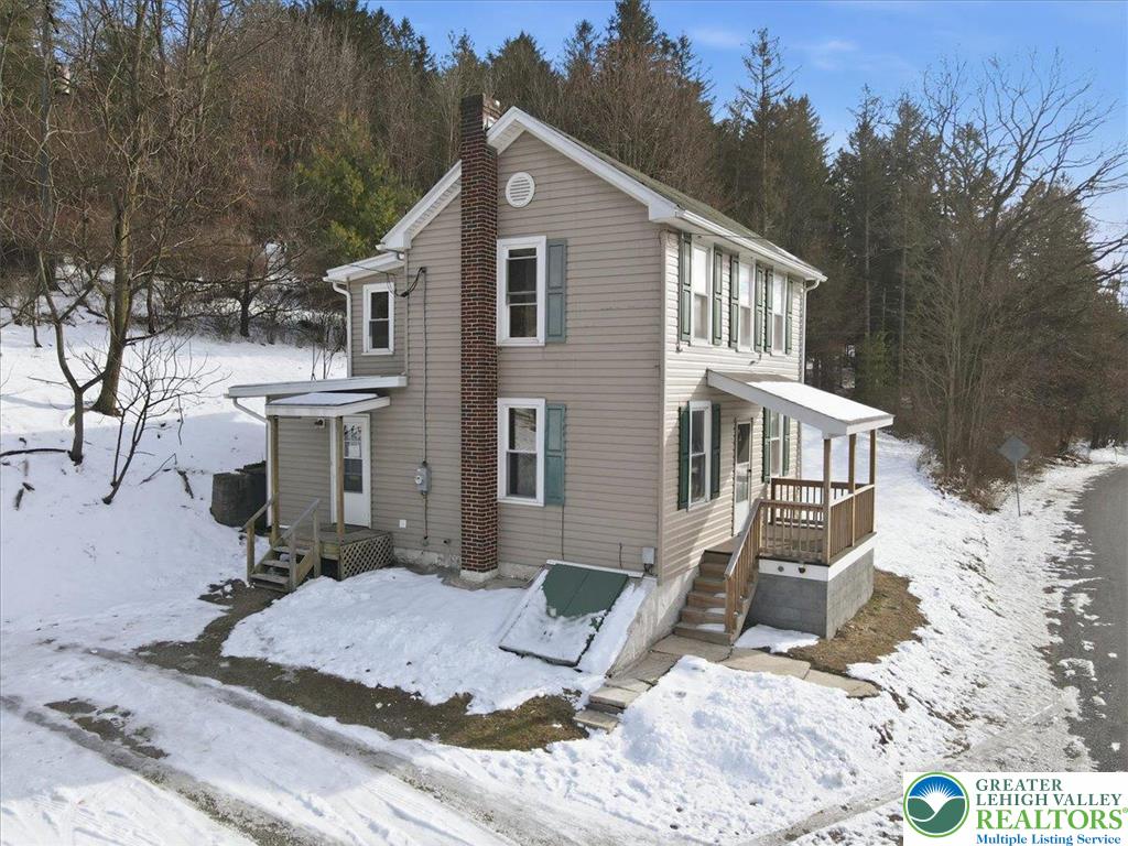 1032 Clamtown Road New Ringgold, PA 17960 - Photo 46 of 68 a front view of a house with a yard
