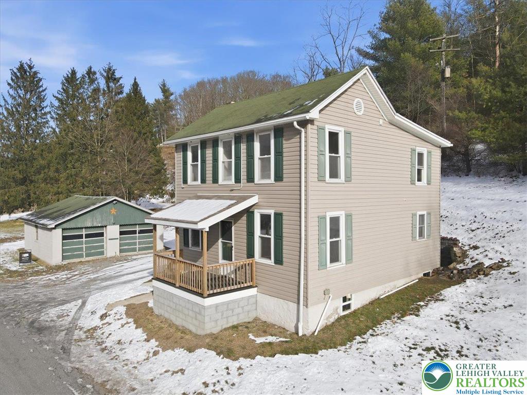1032 Clamtown Road New Ringgold, PA 17960 - Photo 5 of 68 a front view of a house with a yard