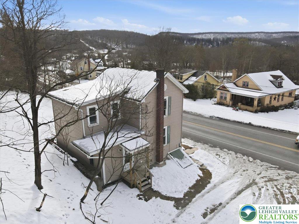 1032 Clamtown Road New Ringgold, PA 17960 - Photo 52 of 68 a view of a balcony with two chairs and a potted plant
