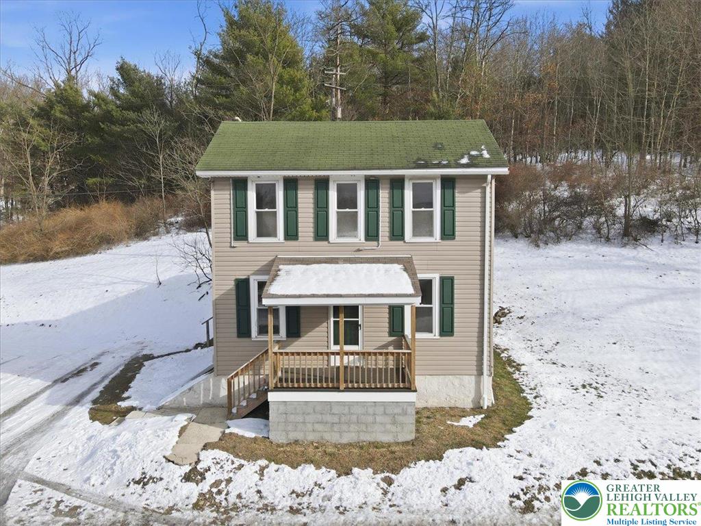 1032 Clamtown Road New Ringgold, PA 17960 - Photo 6 of 68 a front view of a house with a yard