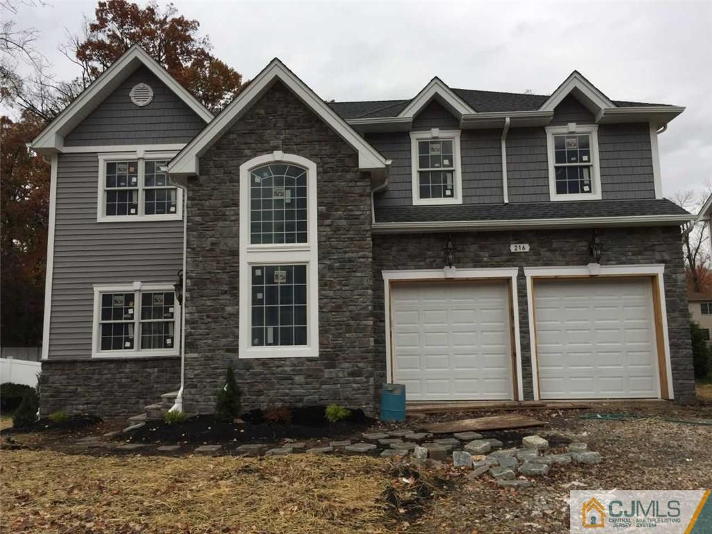 216 Oxford Road Edison, NJ 08820 - Photo 1 of 13 a front view of a house with a yard