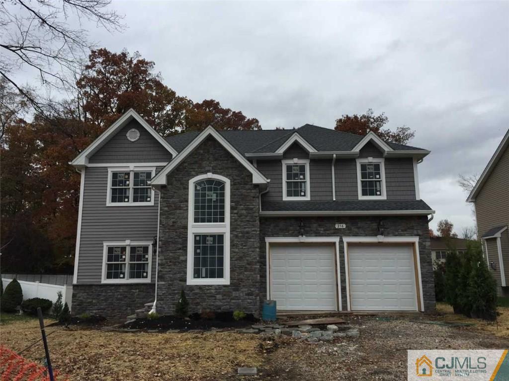 216 Oxford Road Edison, NJ 08820 - Photo 2 of 13 a front view of a house with a yard