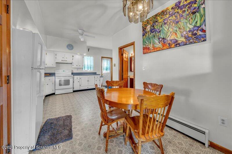 1228 Lake Road Factoryville, PA 18419 - Photo 23 of 43 a dining room with furniture and chandelier