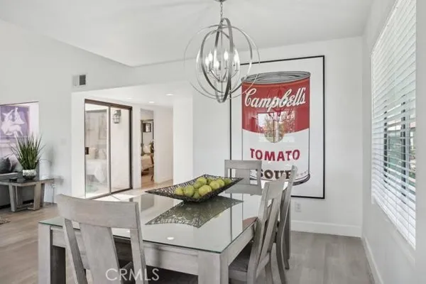 a view of a dining area with furniture and wooden floor