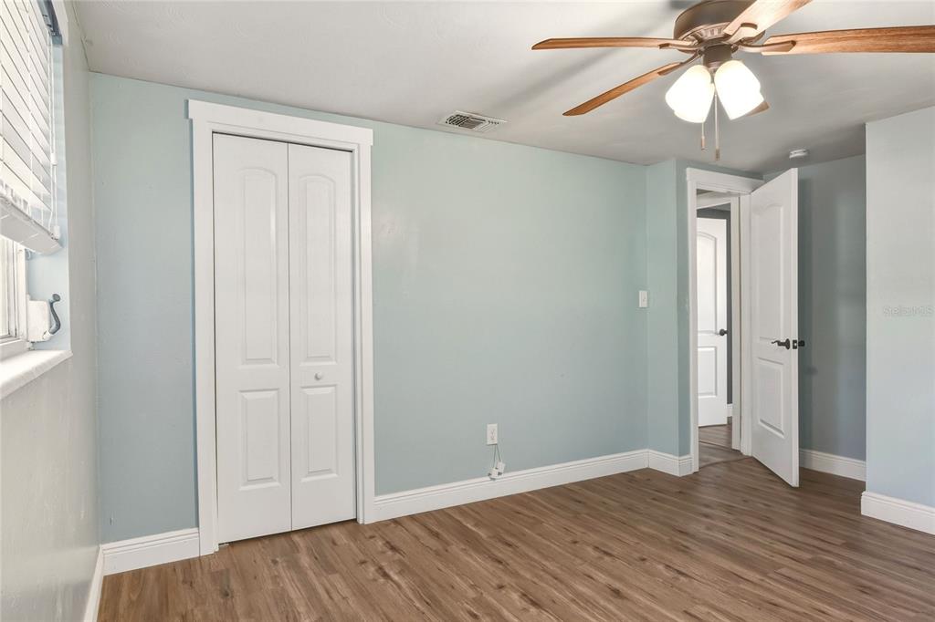 3210 Decatur Avenue Lakeland, FL 33805 - Photo 20 of 37 wooden floor in an empty room with a window