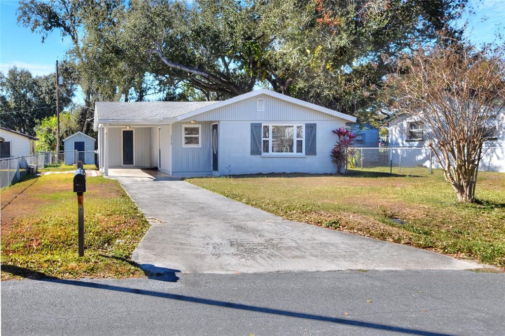 3210 Decatur Avenue Lakeland, FL 33805 - Photo 2 of 37 a view of a house with a yard