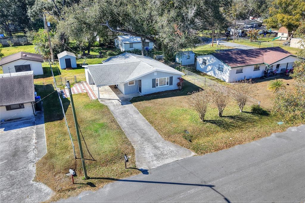 3210 Decatur Avenue Lakeland, FL 33805 - Photo 3 of 37 an aerial view of a house with swimming pool and large trees