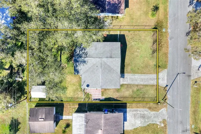 an aerial view of residential house with outdoor space