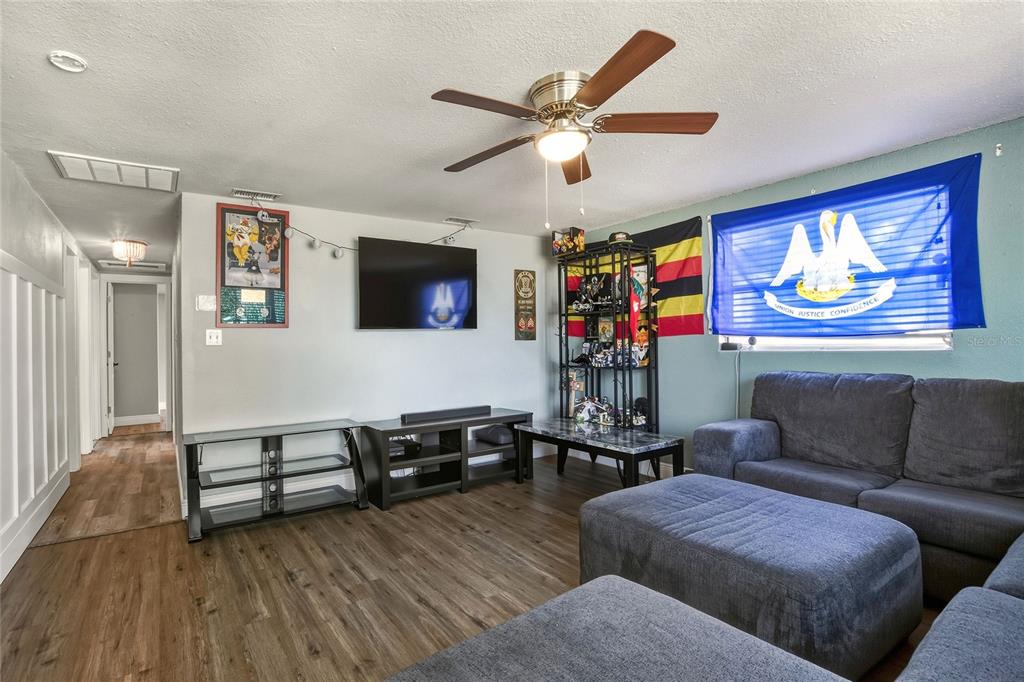 3210 Decatur Avenue Lakeland, FL 33805 - Photo 7 of 37 a living room with furniture and a flat screen tv