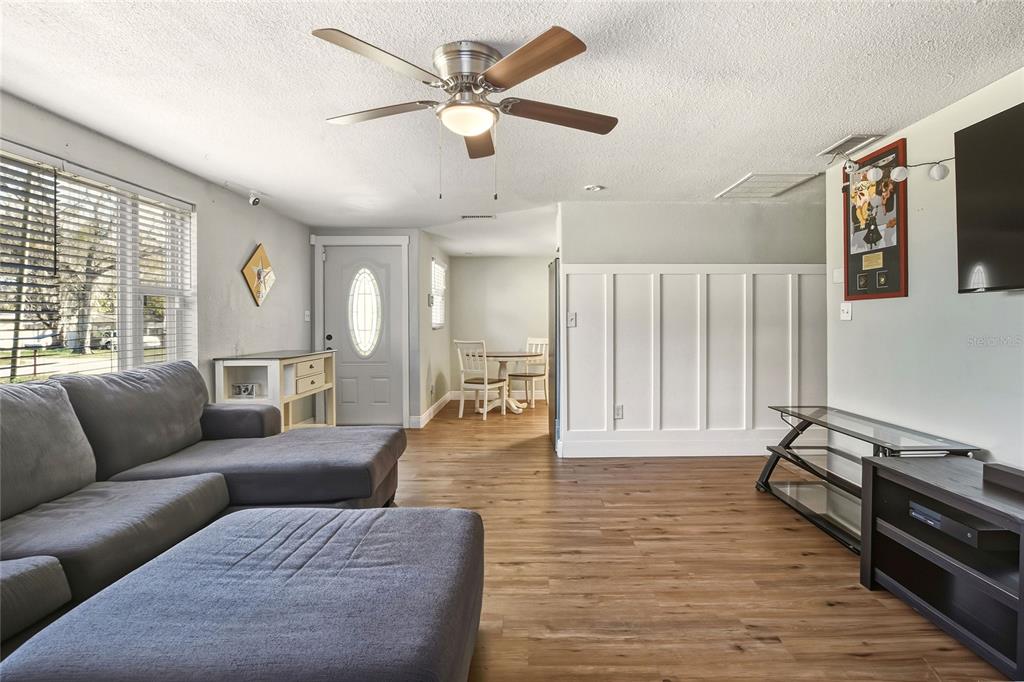 3210 Decatur Avenue Lakeland, FL 33805 - Photo 9 of 37 a living room with furniture and wooden floor