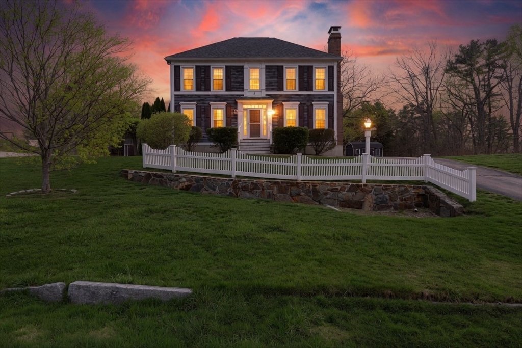54 Old Merrill Street Amesbury, MA 01913 - Photo 2 of 34 a front view of a house with a garden