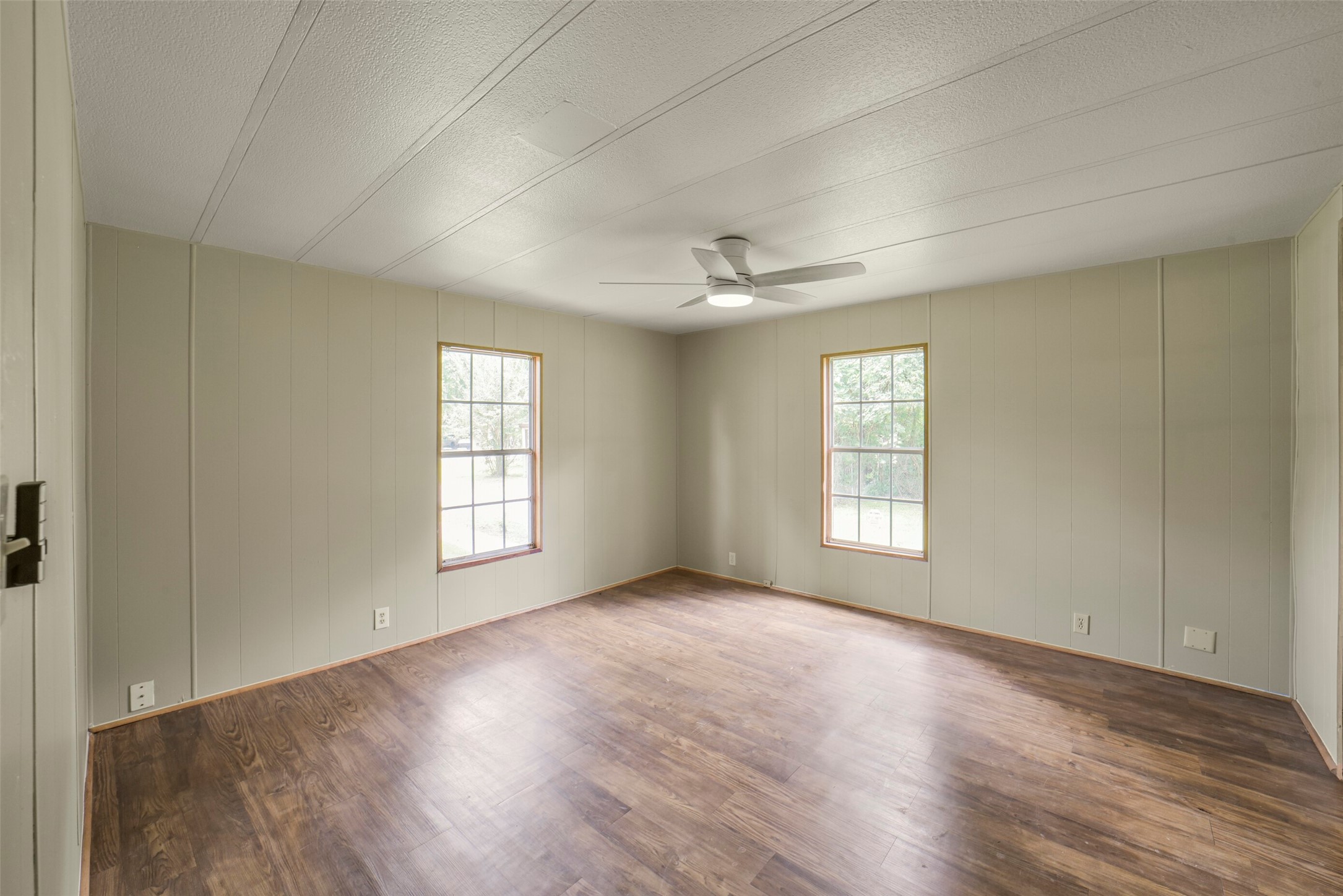 11023 Forrest Valley Drive Houston, TX 77065 - Photo 23 of 47 wooden floor in an empty room with a window