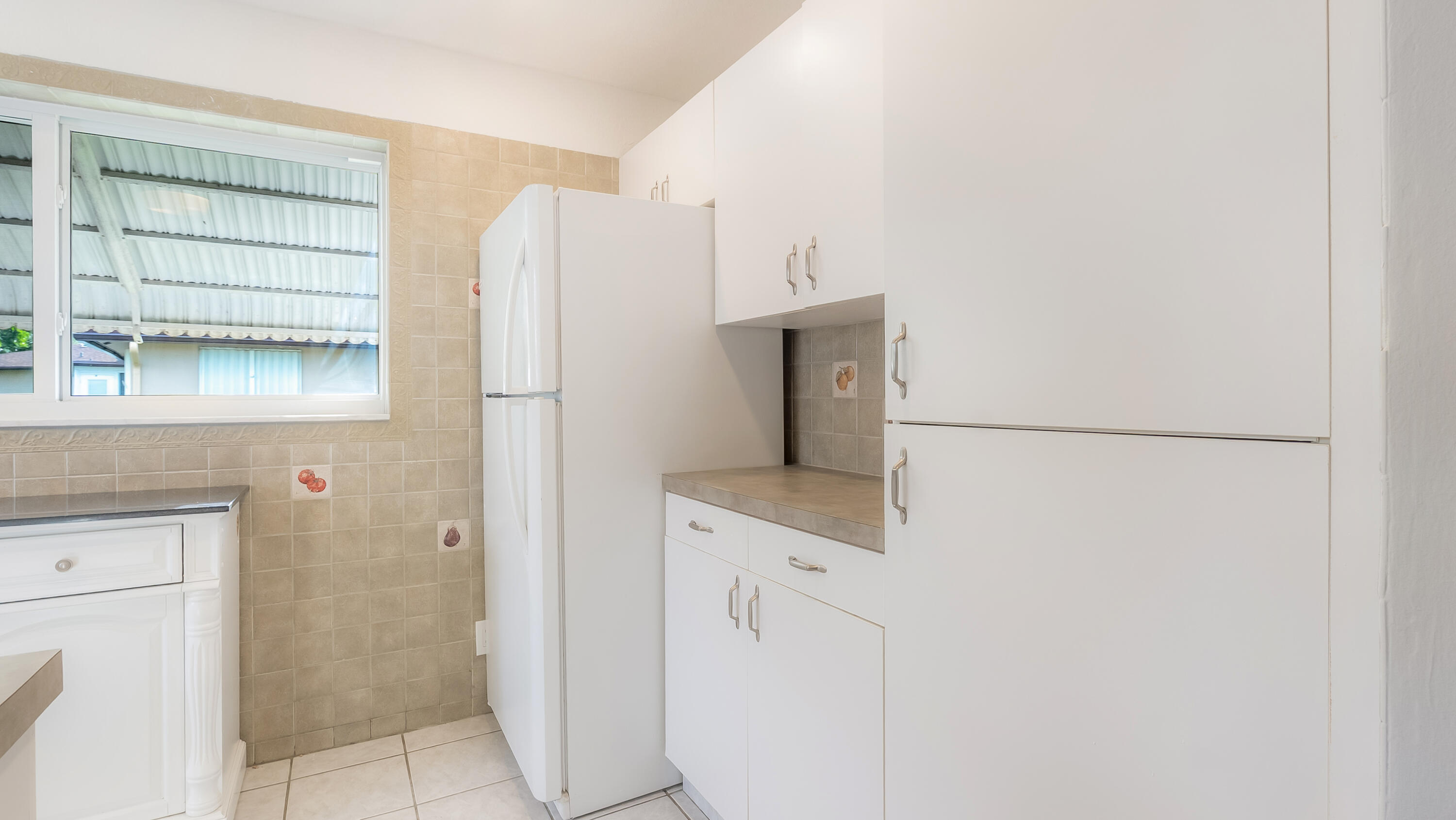 131 Mockingbird Lane Delray Beach, FL 33445 - Photo 11 of 29 a view of bathroom with shower