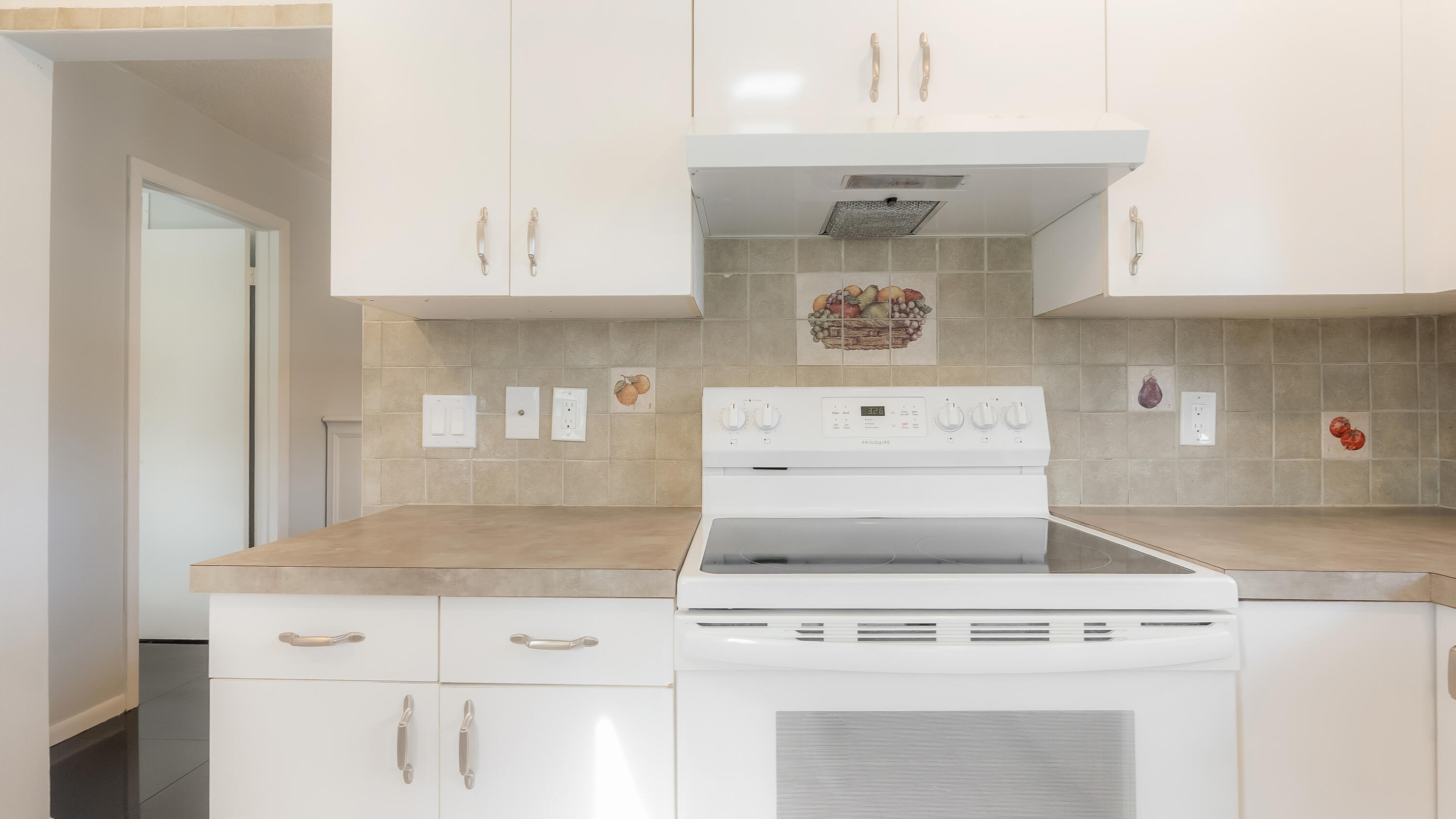131 Mockingbird Lane Delray Beach, FL 33445 - Photo 13 of 29 a stove top oven sitting inside of a kitchen