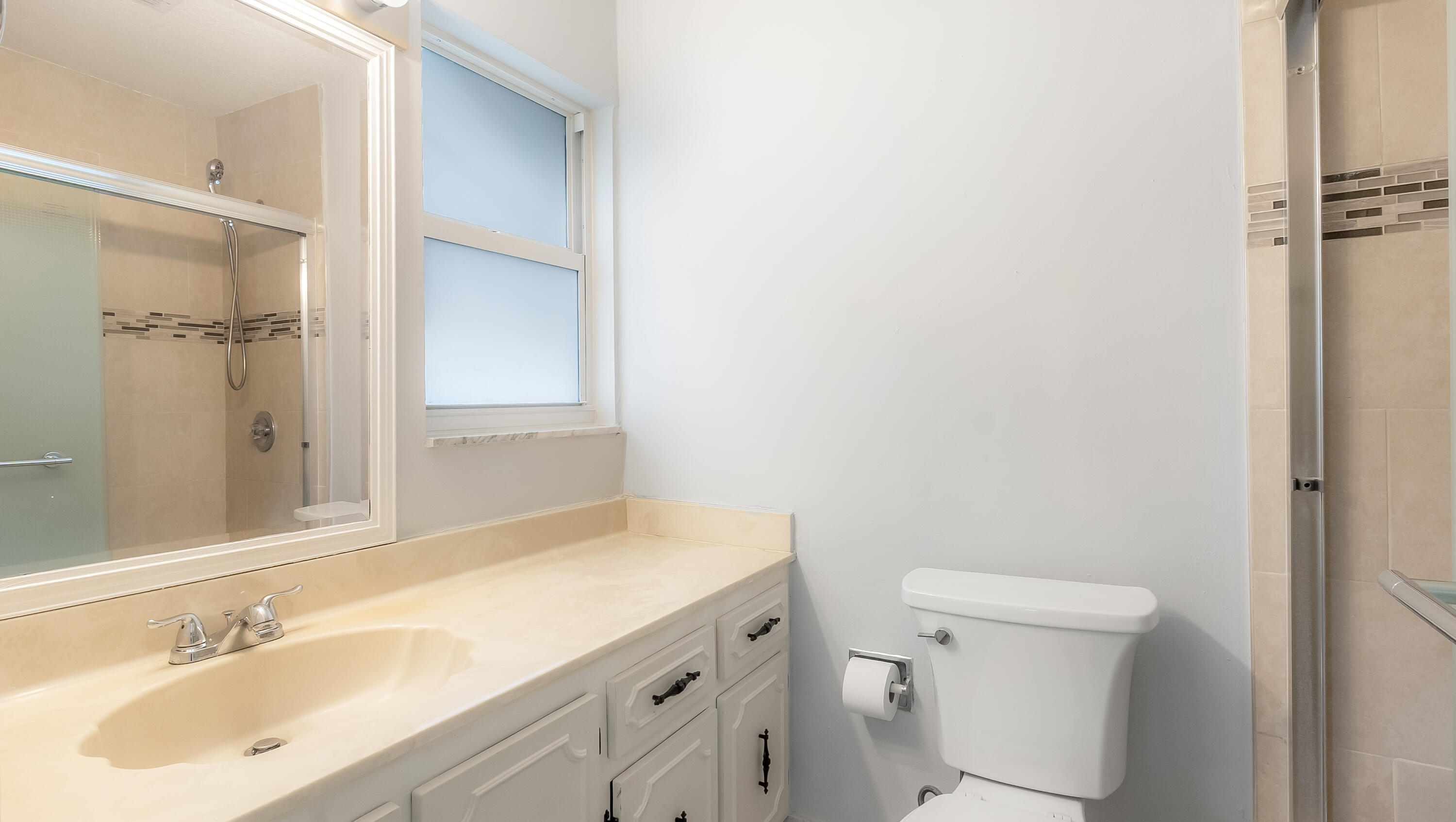 131 Mockingbird Lane Delray Beach, FL 33445 - Photo 17 of 29 a bathroom with a sink toilet and shower