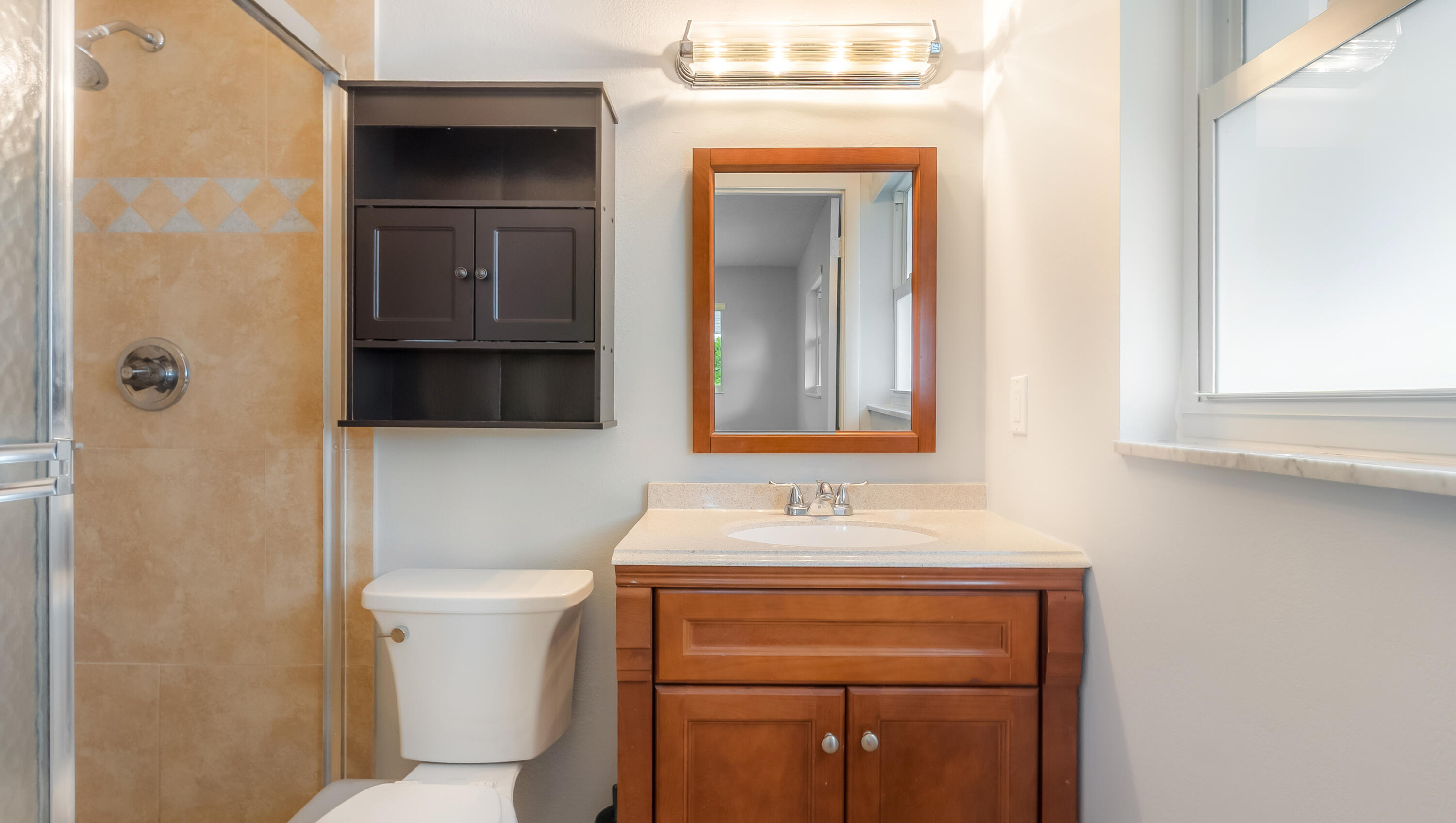 131 Mockingbird Lane Delray Beach, FL 33445 - Photo 23 of 29 a bathroom with a sink and a mirror
