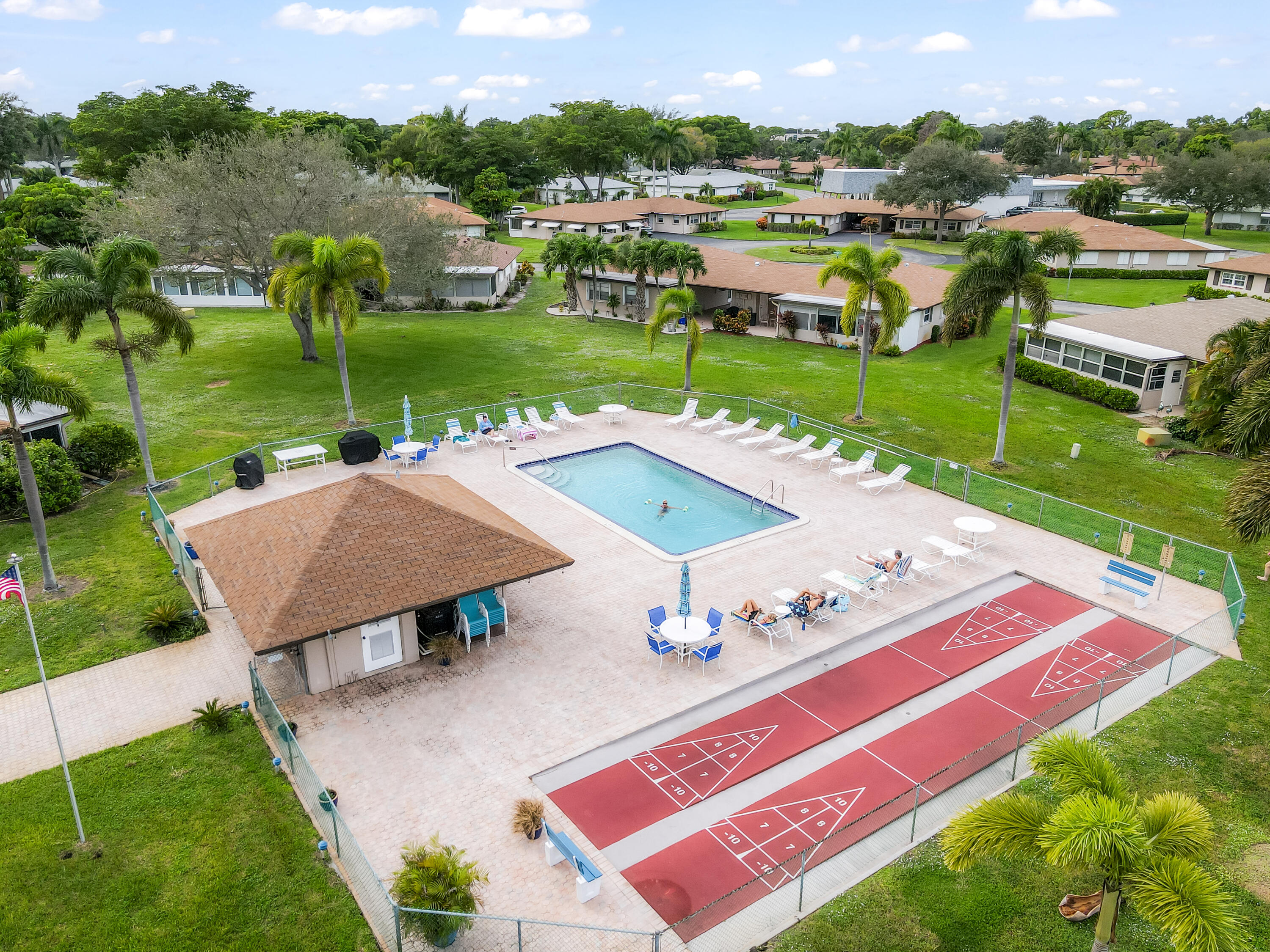 131 Mockingbird Lane Delray Beach, FL 33445 - Photo 29 of 29 an aerial view of a house with outdoor space patio and lake view