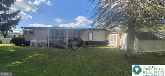 a view of a back yard of the house