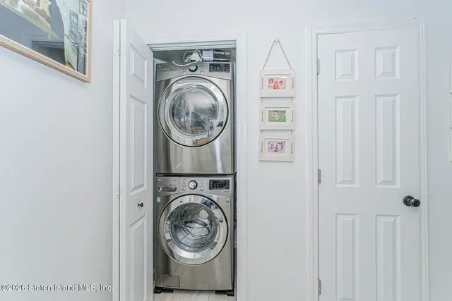 a view of a hallway with wooden floor and entryway