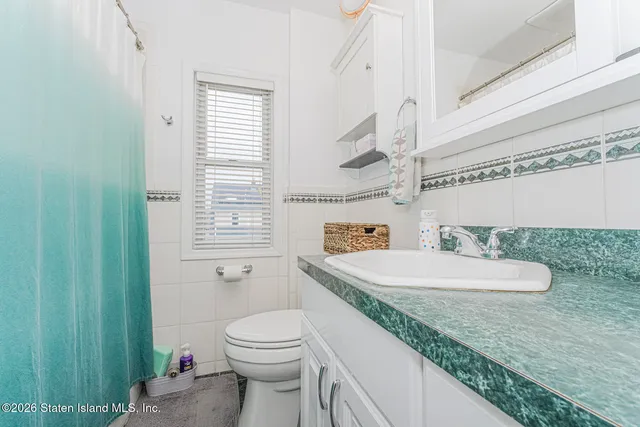 a bathroom with a shower and a curtain