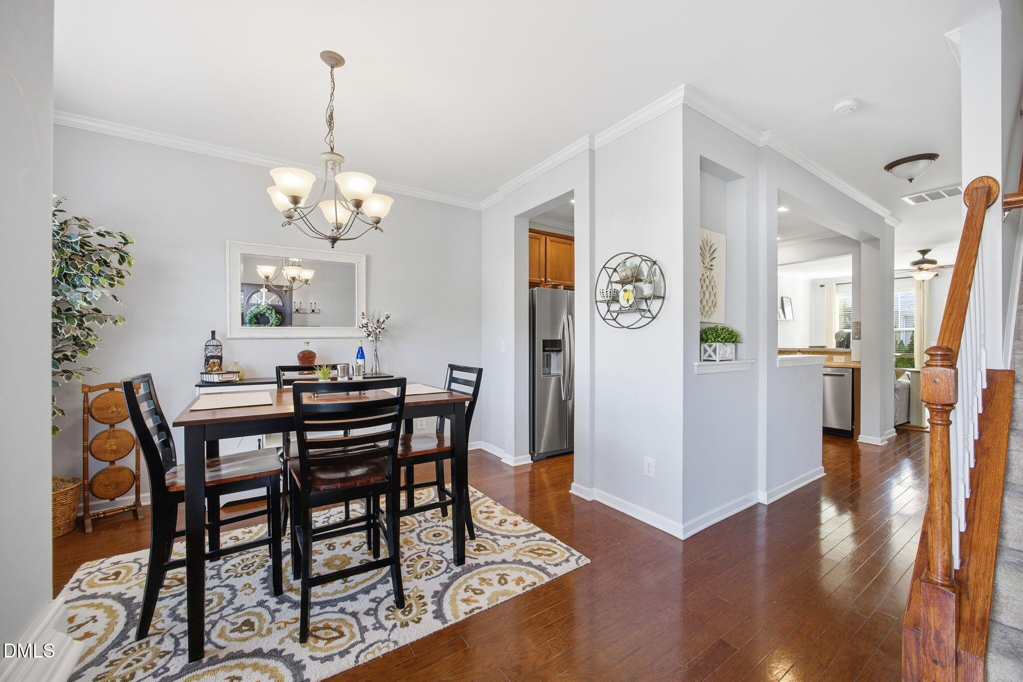 2827 Corbett Grove Drive Raleigh, NC 27616 - Photo 11 of 49 a view of a dining room with furniture wooden floor and a chandelier