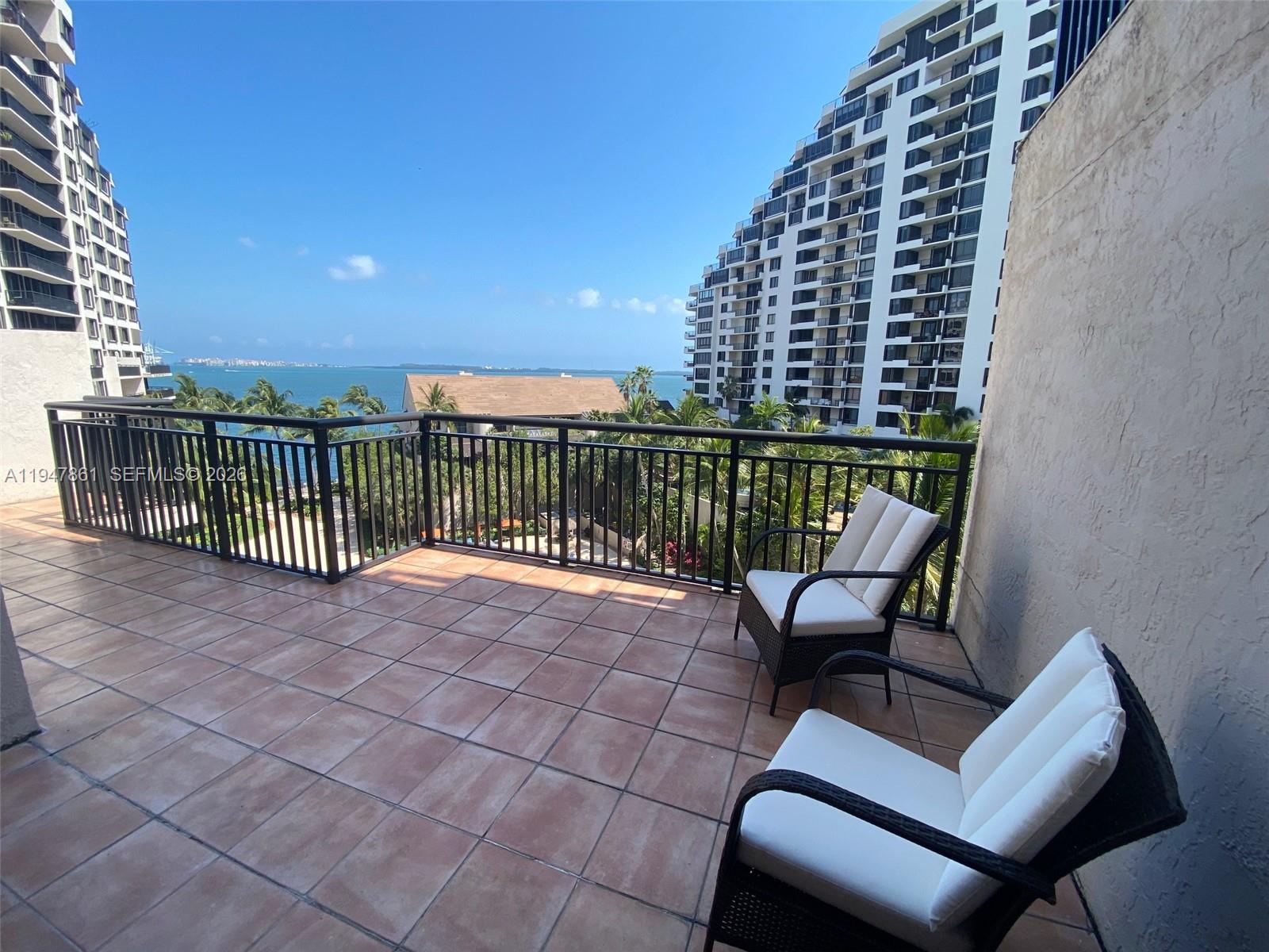 540 Brickell Key Drive, Unit 705 Miami, FL 33131 - Photo 24 of 38 a view of a balcony with a couch