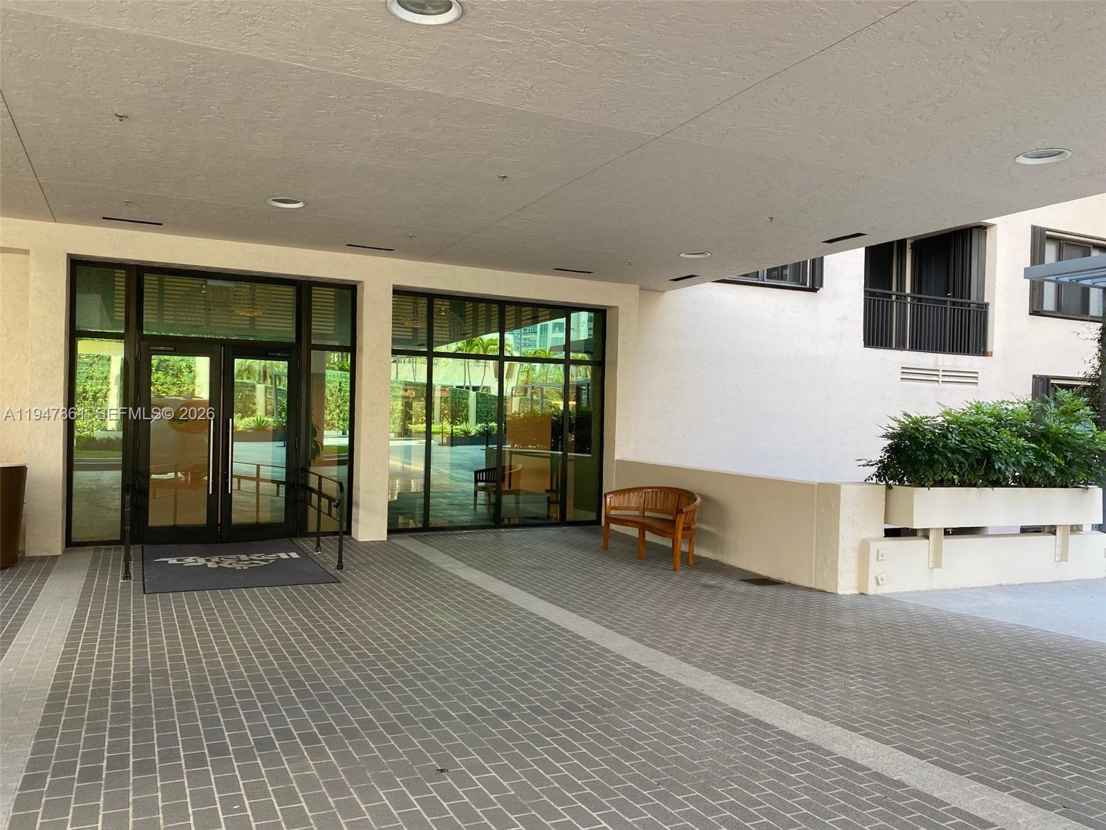 540 Brickell Key Drive, Unit 705 Miami, FL 33131 - Photo 26 of 38 a view of a porch with a table and chairs