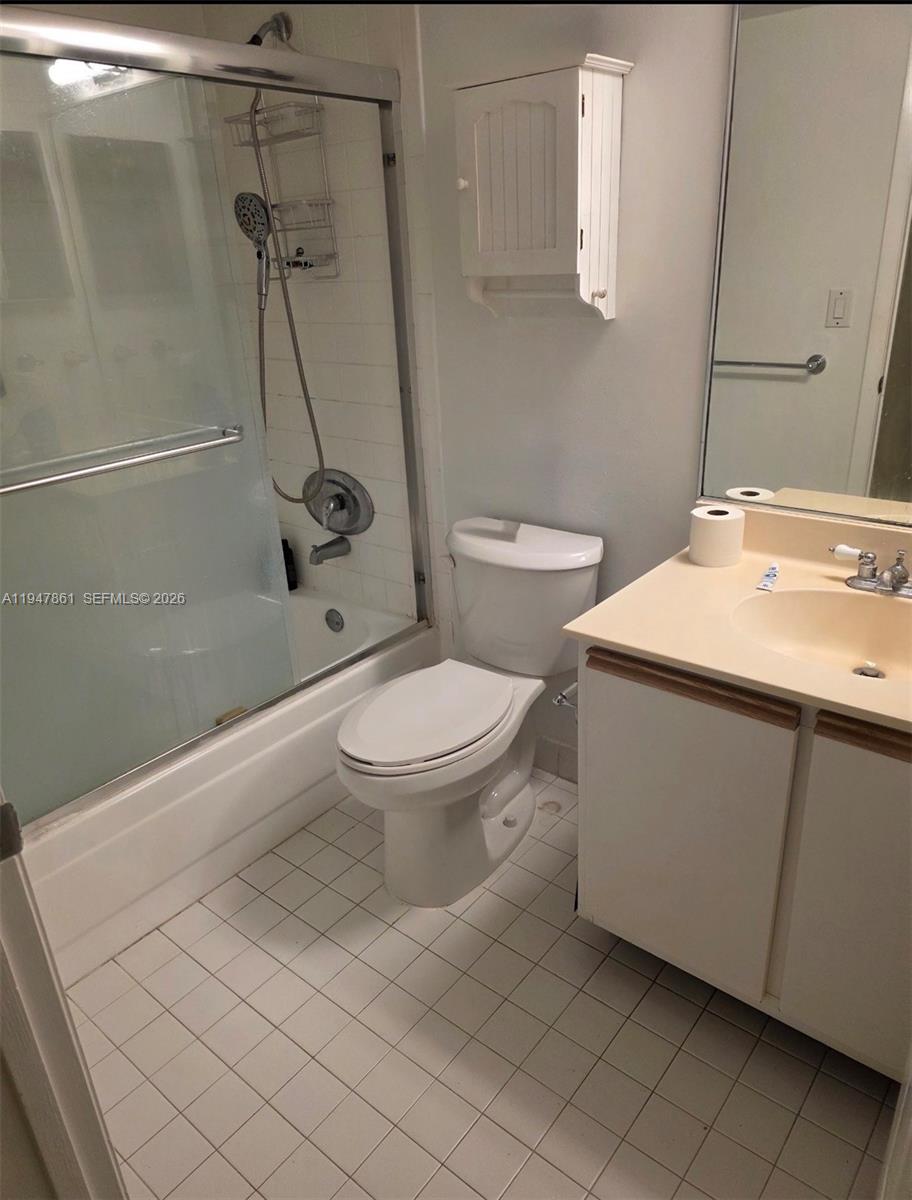 540 Brickell Key Drive, Unit 705 Miami, FL 33131 - Photo 27 of 38 a bathroom with a sink toilet and shower