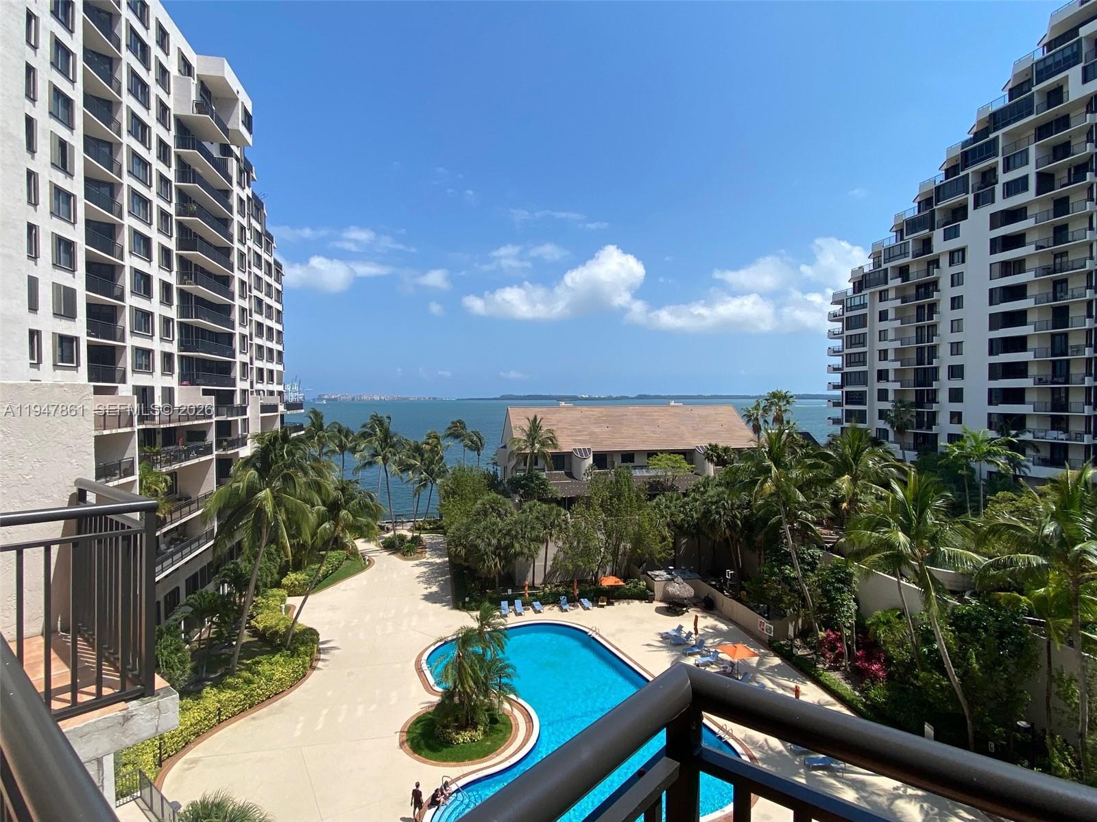 540 Brickell Key Drive, Unit 705 Miami, FL 33131 - Photo 3 of 38 a view of a backyard with plants and lake view