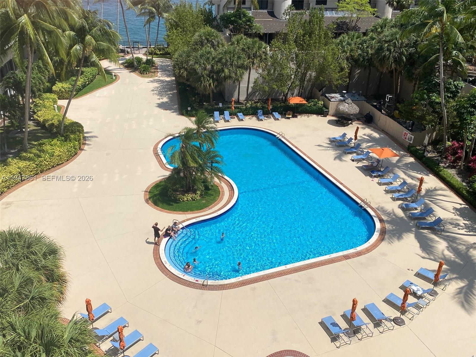 540 Brickell Key Drive, Unit 705 Miami, FL 33131 - Photo 4 of 38 a view of a swimming pool with a yard