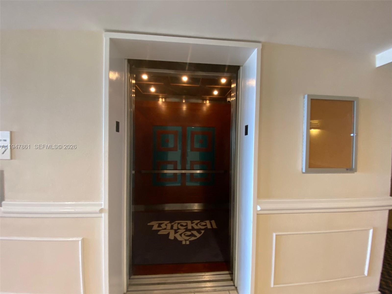 540 Brickell Key Drive, Unit 705 Miami, FL 33131 - Photo 8 of 38 a view of a hallway with elevator