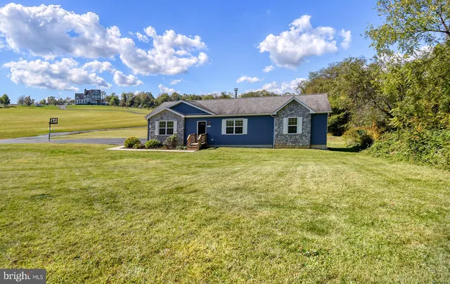 a view of a house with a big yard