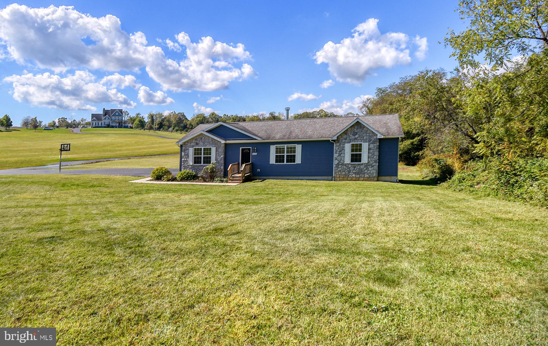 a view of a house with a big yard
