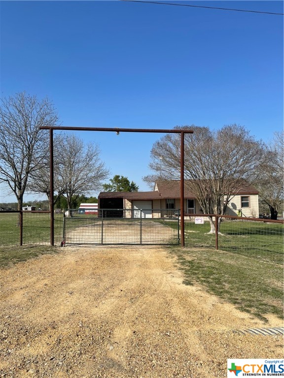 a view of swimming pool with outdoor seating and yard