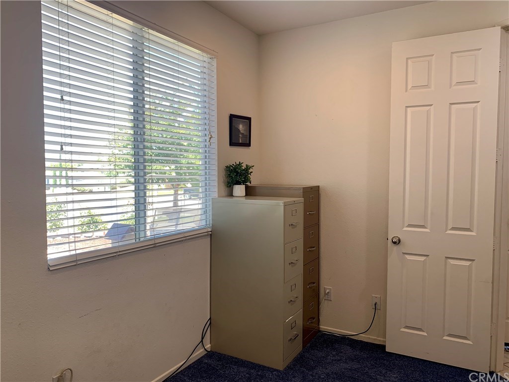 24817 Butterchurn Road Wildomar, CA 92595 - Photo 20 of 39 Den/office (or could use as 4th bedroom) has double door entry near the living room, plus a great view through the front yard and out to the hills.