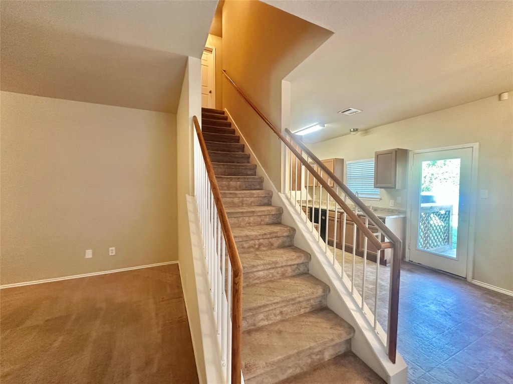 2624 Haselwood Lane Round Rock, TX 78665 - Photo 16 of 20 a view of a hallway with wooden floor and entryway