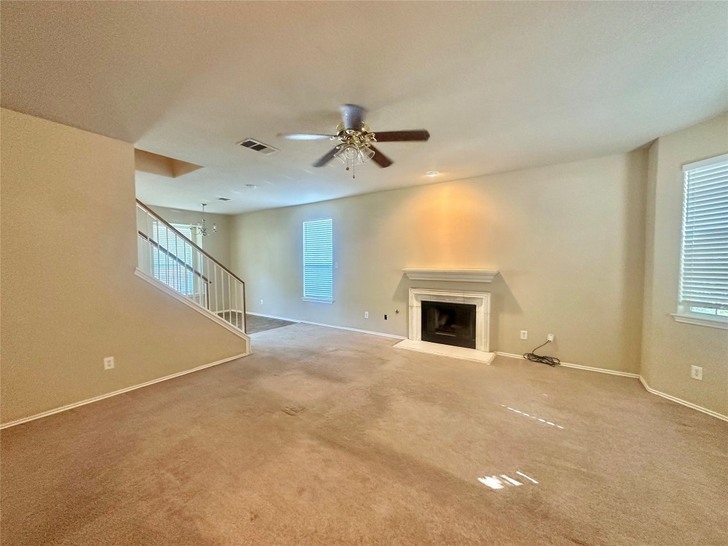 2624 Haselwood Lane Round Rock, TX 78665 - Photo 2 of 20 a view of a livingroom with a fireplace and window