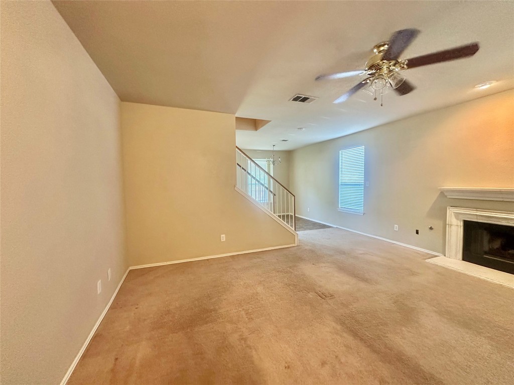 2624 Haselwood Lane Round Rock, TX 78665 - Photo 3 of 20 a view of a livingroom with a ceiling fan and a rug