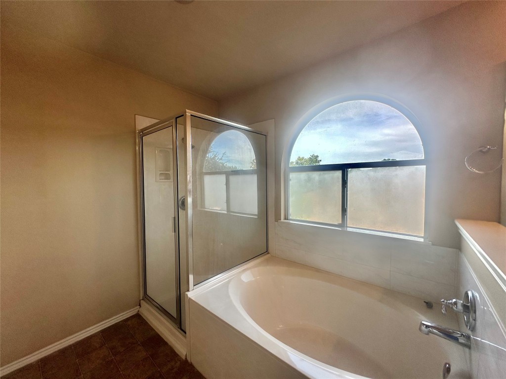 2624 Haselwood Lane Round Rock, TX 78665 - Photo 10 of 20 a bathroom with a tub and shower