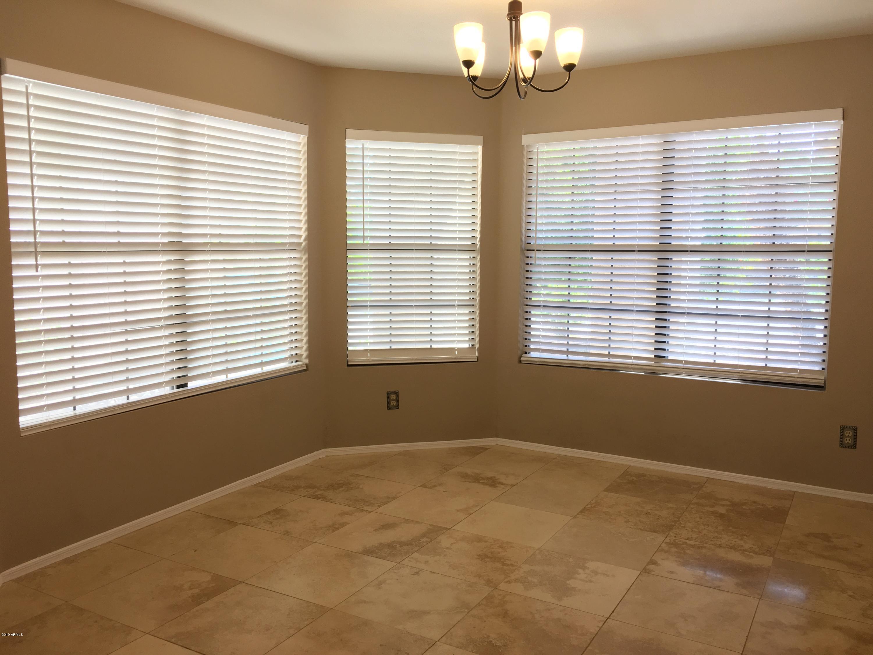 5956 East Phelps Road Scottsdale, AZ 85254 - Photo 8 of 29 a view of an empty room with a window