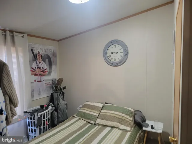 a view of a room with lots of stuff and hardwood floor