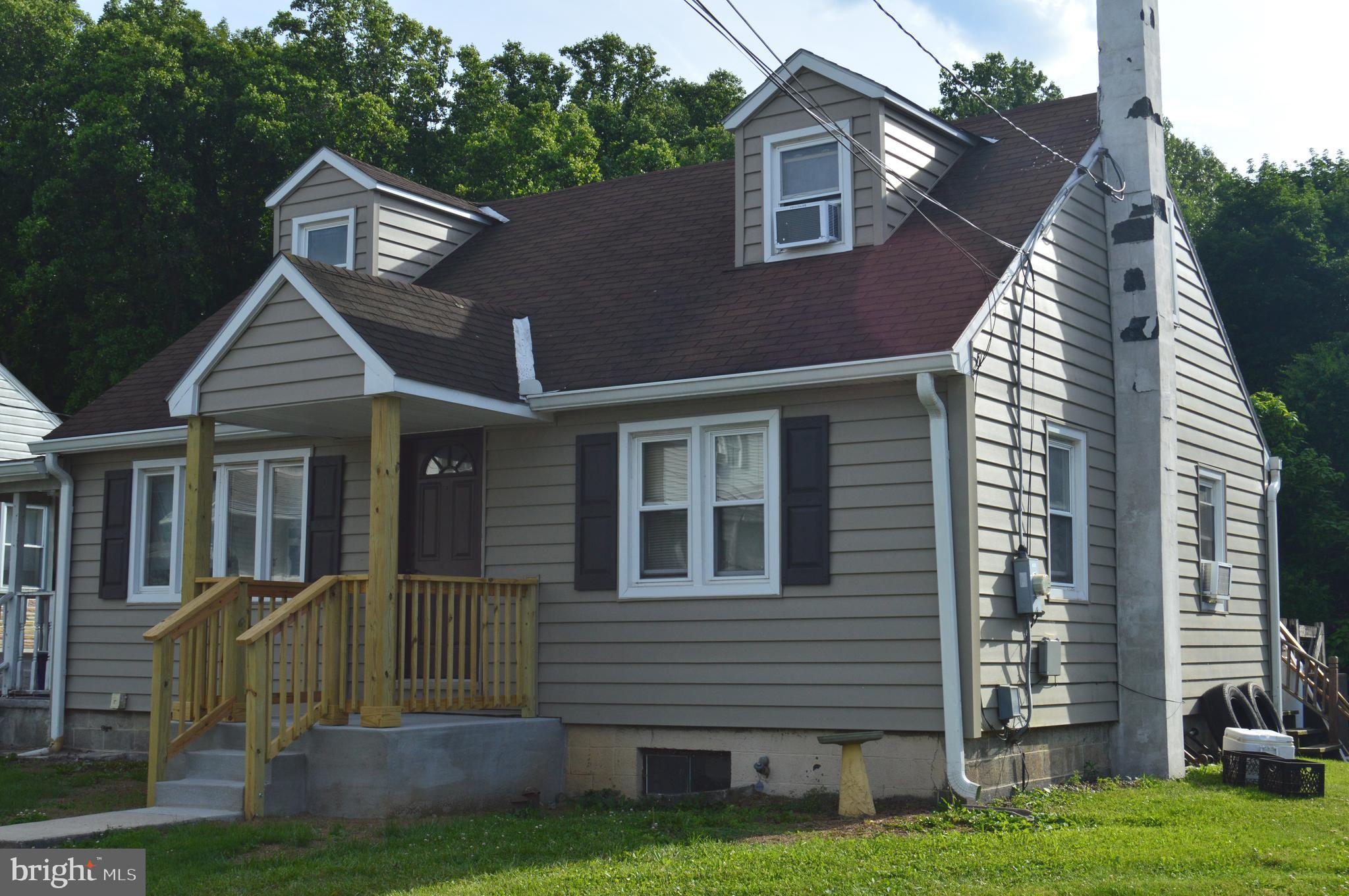 46 Mountain Spring Road Blandon, PA 19510 - Photo 1 of 18 a front view of a house with a yard
