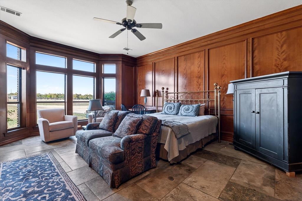 1500 Eden Ridge Celina, TX 75009 - Photo 15 of 40 a spacious bedroom with a bed a couch and large window