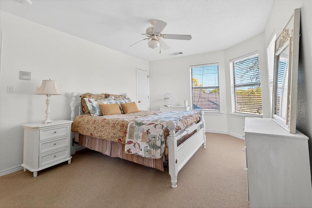 1500 Eden Ridge Celina, TX 75009 - Photo 17 of 40 a bedroom with a bed chandelier and a window