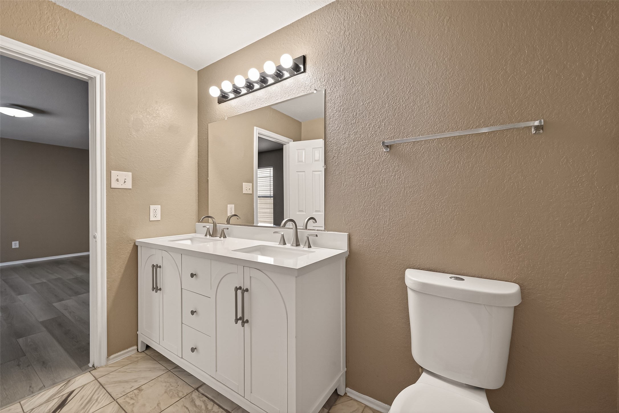 2918 Latch Lane Houston, TX 77038 - Photo 13 of 23 a bathroom with a toilet sink and mirror