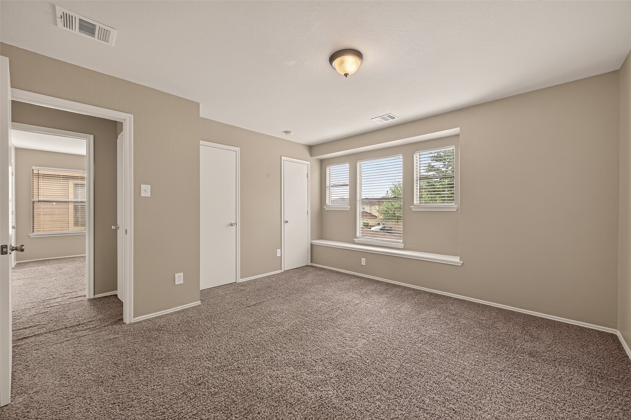 2918 Latch Lane Houston, TX 77038 - Photo 17 of 23 an empty room with windows and closet