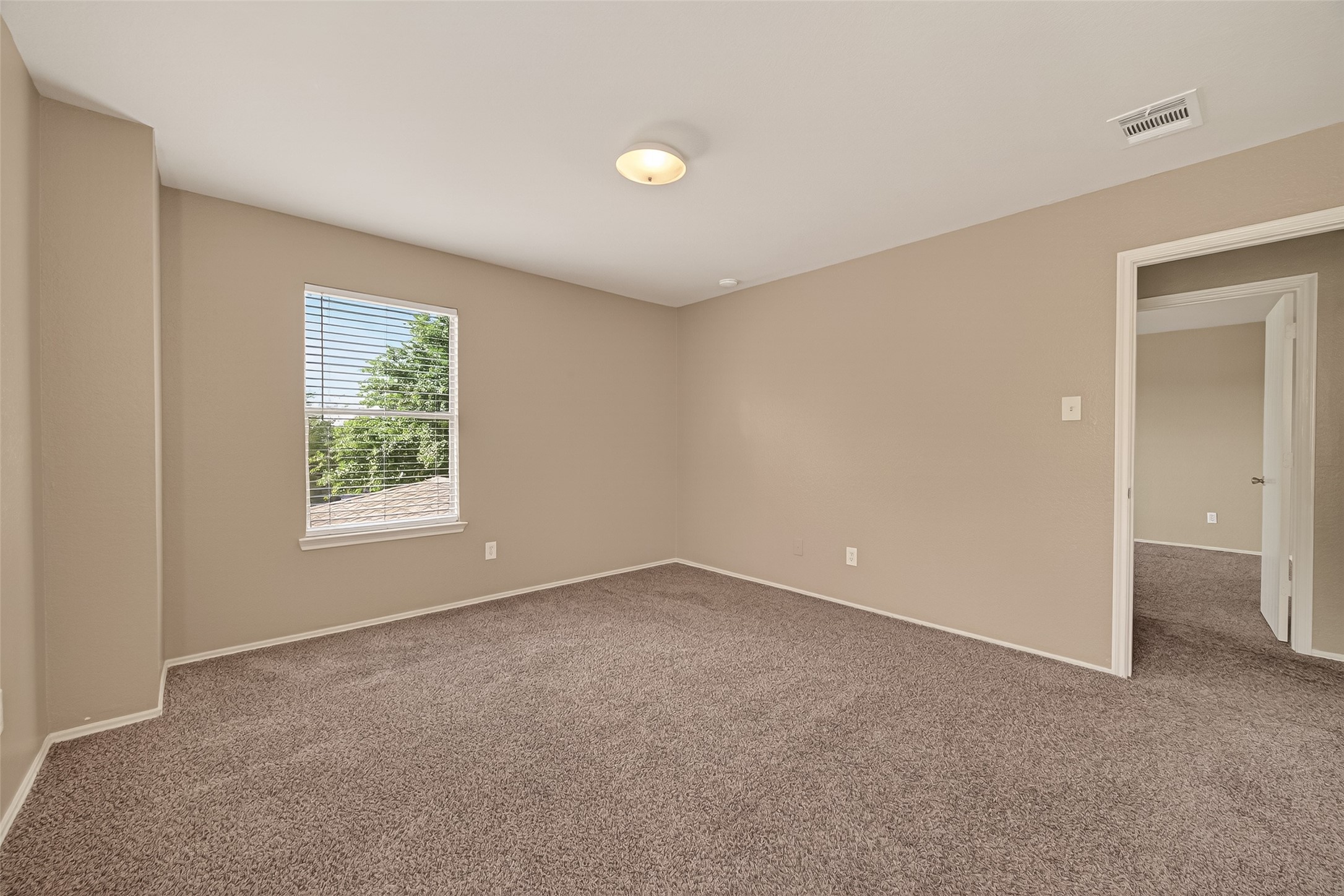 2918 Latch Lane Houston, TX 77038 - Photo 19 of 23 an empty room with windows and closet